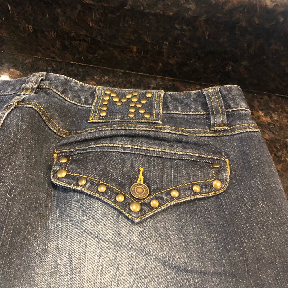 Jeans with gold studded trim wide leg